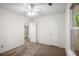Cozy bedroom features plush carpeting, a ceiling fan, and ample natural light at 11006 Clearwater Dr, Hampton, GA 30228