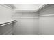 Walk-in closet with white shelving, ready for organization at 11006 Clearwater Dr, Hampton, GA 30228