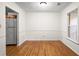 Classic dining room with hardwood floors, wainscoting, and natural light from window at 11006 Clearwater Dr, Hampton, GA 30228