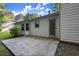 Back exterior view of the home, featuring a patio, and well maintained lawn at 11006 Clearwater Dr, Hampton, GA 30228