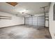 Clean, open garage with overhead lighting and an automatic door at 11006 Clearwater Dr, Hampton, GA 30228
