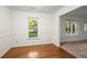 Inviting living room area features hardwood floors and plenty of natural light at 11006 Clearwater Dr, Hampton, GA 30228