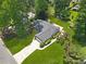 Aerial view of the property highlighting the landscaped yard and spacious driveway at 1208 Brandl Sw Dr, Marietta, GA 30008