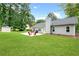 Lush green backyard with a patio, perfect for outdoor gatherings and relaxation at 1208 Brandl Sw Dr, Marietta, GA 30008