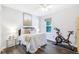 Bedroom with hardwood floors, neutral paint, and stationary bike at 1208 Brandl Sw Dr, Marietta, GA 30008