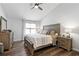Spacious bedroom features a ceiling fan, hardwood floors and plentiful natural light at 1208 Brandl Sw Dr, Marietta, GA 30008