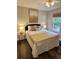 Cozy bedroom featuring a comfortable bed with decorative pillows and a ceiling fan at 1208 Brandl Sw Dr, Marietta, GA 30008