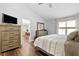 The bedroom boasts dark wood floors, natural light and adjoins the kitchen and living room at 1208 Brandl Sw Dr, Marietta, GA 30008