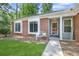 Charming entryway with decorative bench seating and a well-manicured lawn at 1208 Brandl Sw Dr, Marietta, GA 30008
