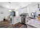 Close-up of a well-lit kitchen area with stainless steel appliances and granite countertops at 1208 Brandl Sw Dr, Marietta, GA 30008