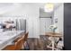Bright kitchen featuring granite countertops, white cabinetry, and stainless steel appliances at 1208 Brandl Sw Dr, Marietta, GA 30008