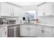 Kitchen with white cabinets, granite countertops, and stainless steel appliances at 1208 Brandl Sw Dr, Marietta, GA 30008