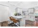 Modern kitchen with granite countertops, white cabinets, and stainless steel appliances at 1208 Brandl Sw Dr, Marietta, GA 30008