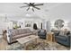Spacious living area with a large rug, neutral-toned furniture, and ample natural light at 1208 Brandl Sw Dr, Marietta, GA 30008