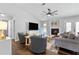 Comfortable living room with a fireplace, TV, ceiling fan and gray-toned furniture and accents at 1208 Brandl Sw Dr, Marietta, GA 30008