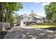 Spacious backyard with a screened-in porch, outdoor seating, and driveway at 1297 Conway Rd, Decatur, GA 30030