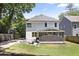 Expansive backyard with a screened-in porch, outdoor seating and a lush lawn at 1297 Conway Rd, Decatur, GA 30030