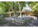 Backyard patio features a hammock, stone features and ample seating space at 1297 Conway Rd, Decatur, GA 30030