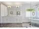 Bright bathroom featuring marble floors, dual vanity, and a modern glass-enclosed tub at 1297 Conway Rd, Decatur, GA 30030