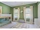 Shared room with a wood bunk bed, ample windows, and stylish decor at 1297 Conway Rd, Decatur, GA 30030