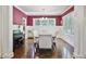 Elegant dining room with wainscoting, stylish chandelier, and ample natural light at 1297 Conway Rd, Decatur, GA 30030