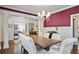 Elegant dining room featuring a large table and stylish decor with open concept to living space at 1297 Conway Rd, Decatur, GA 30030