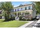 Beautiful two-story home with a charming front porch, well-maintained landscaping, and long driveway at 1297 Conway Rd, Decatur, GA 30030