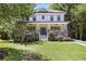 Charming two-story home with a welcoming front porch and lush green lawn at 1297 Conway Rd, Decatur, GA 30030