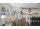 Kitchen with adjacent dining area, stainless appliances, and granite countertops at 1297 Conway Rd, Decatur, GA 30030
