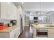 Well-lit kitchen featuring stainless appliances, granite countertops, and open access to living area at 1297 Conway Rd, Decatur, GA 30030