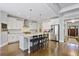 Modern kitchen with stainless appliances, center island with seating, and hardwood flooring at 1297 Conway Rd, Decatur, GA 30030