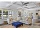 Bright and open living room featuring hardwood floors and a large sectional sofa at 1297 Conway Rd, Decatur, GA 30030
