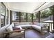 Inviting screened-in porch with cozy seating, ideal for enjoying the outdoors in comfort at 1297 Conway Rd, Decatur, GA 30030