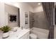 Modern bathroom featuring elegant fixtures, sleek vanity, and a shower-tub combo for relaxation at 3564 Shore Wood Ave, Lawrenceville, GA 30044