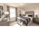 Well-lit bedroom with stylish decor, comfortable bed, and sporty soccer-themed wall decorations at 3564 Shore Wood Ave, Lawrenceville, GA 30044
