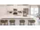 A bright kitchen with an island and seating offers a perfect spot for meal prep and casual dining at 3564 Shore Wood Ave, Lawrenceville, GA 30044