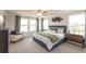 Serene main bedroom with plush carpet, stylish decor, and large windows for ample natural light at 3564 Shore Wood Ave, Lawrenceville, GA 30044