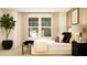 Inviting bedroom featuring a large window, stylish decor, and elegant furnishings at 416 Valley View Trl, Canton, GA 30115