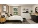 Bedroom featuring neutral walls, window, comfortable bed, and dresser with decor at 416 Valley View Trl, Canton, GA 30115