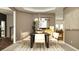 Chic dining area with a large table, stylish seating, and unique wall art at 416 Valley View Trl, Canton, GA 30115
