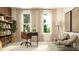 Bright home office featuring large windows, comfortable seating area, decor, and desk at 416 Valley View Trl, Canton, GA 30115