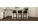 Bright eat-in kitchen featuring stainless steel appliances and stylish woven counter stools at 416 Valley View Trl, Canton, GA 30115