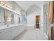 Light-filled bathroom with double vanity, soaking tub, and separate shower, perfect for relaxation at 4295 Cami Way, Buford, GA 30519