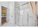 Bathroom features a glass shower with white tile surround and neutral flooring at 4295 Cami Way, Buford, GA 30519