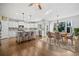Open-concept kitchen and dining area with hardwood floors and stainless steel appliances at 4295 Cami Way, Buford, GA 30519