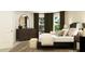 Bedroom with an area rug, a dresser, a window, and neutral-toned walls at 243 Deer Valley Run, Canton, GA 30115