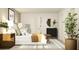 Bright bedroom featuring stylish decor, a round mirror, and ample natural light at 243 Deer Valley Run, Canton, GA 30115