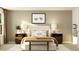 Bedroom with a decorative area rug, mid-century end tables, and neutral-toned walls at 243 Deer Valley Run, Canton, GA 30115