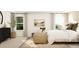 Bright bedroom featuring large windows, a comfortable chair, and stylish decor at 243 Deer Valley Run, Canton, GA 30115