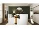 Elegant dining room featuring a large mirror and modern decor, open to the living areas at 243 Deer Valley Run, Canton, GA 30115